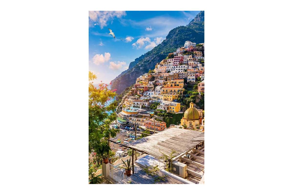 Panoramic view of Positano on the Amalfi Coast, with colorful houses cascading down to the sea.